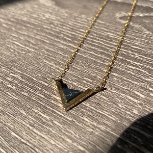 Gold necklace with V design and black marble